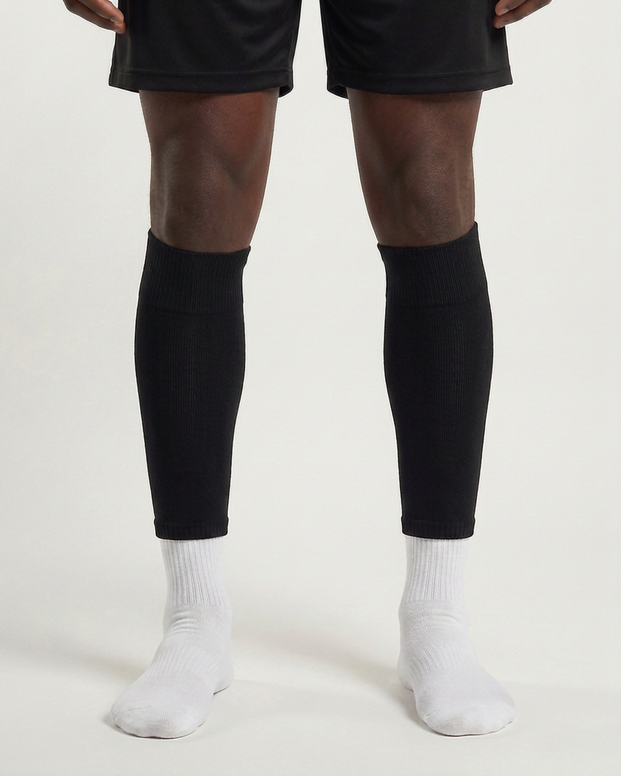 Farrellys World football sock sleeve worn over a white crew sock - Black