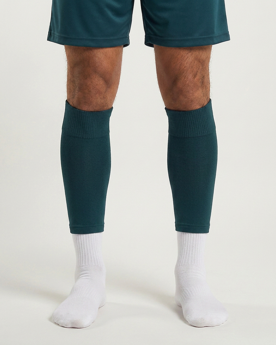Farrellys World football sock sleeve worn over a white crew sock - Forest Green