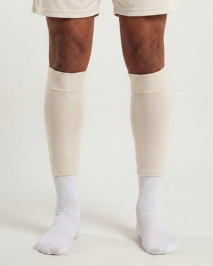 Farrellys World football sock sleeve worn over a white crew sock - Off White