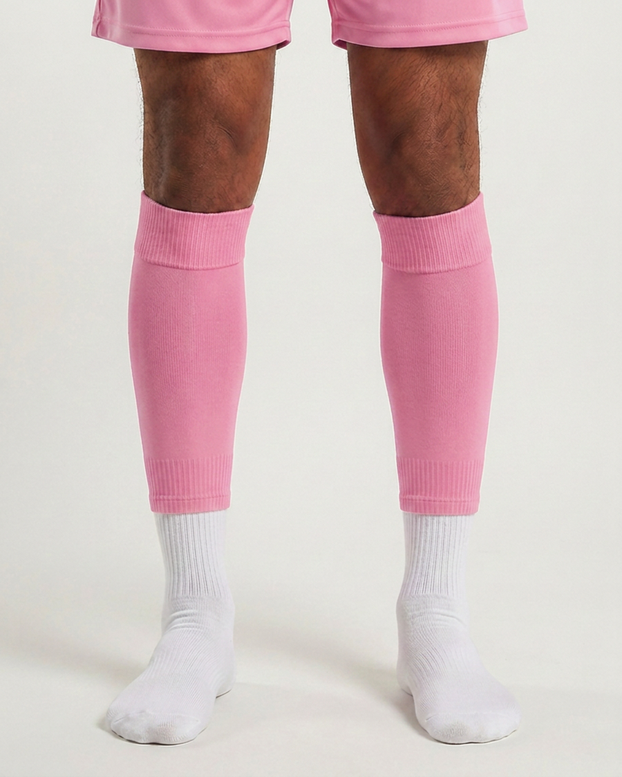 Farrellys World football sock sleeve worn over a white crew sock - Baby Pink