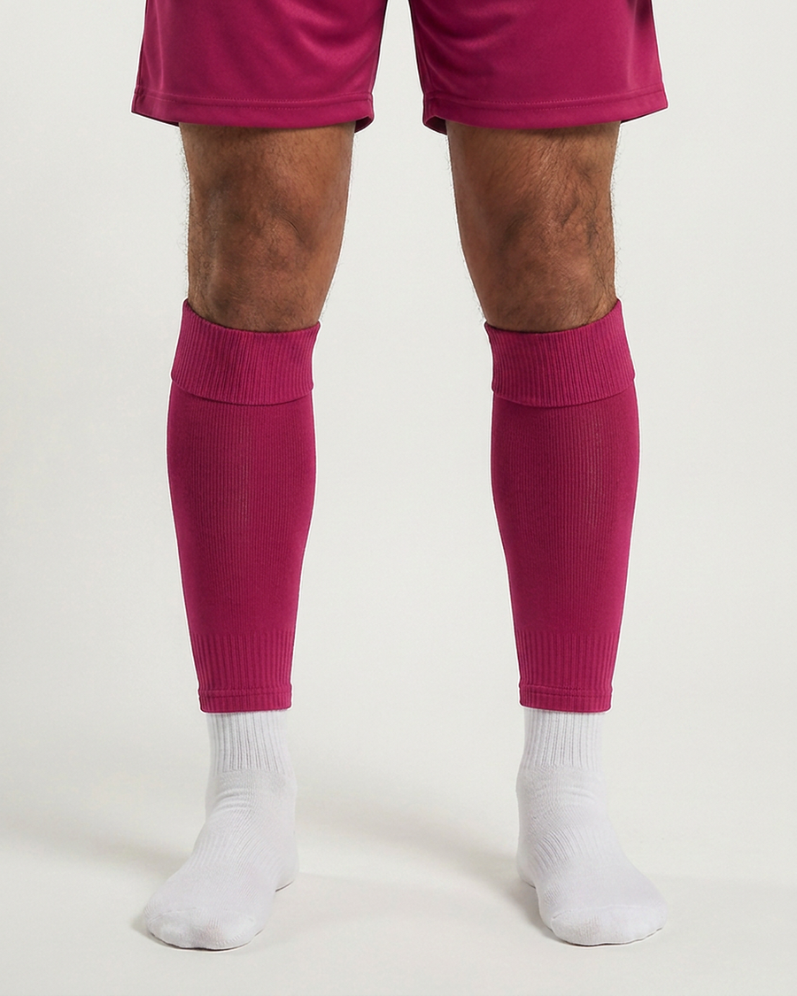 Farrellys World football sock sleeve worn over a white crew sock - Dark Pink