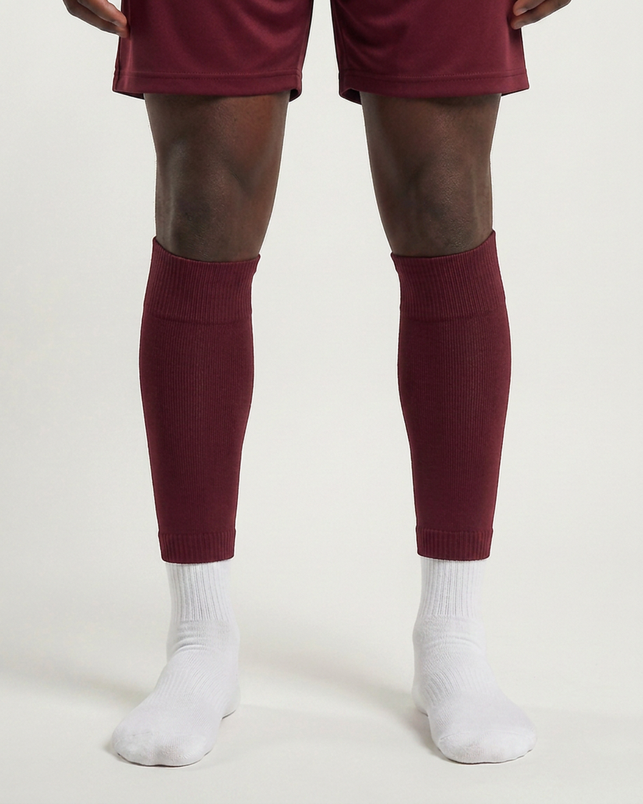 Farrellys World football sock sleeve worn over a white crew sock - Maroon