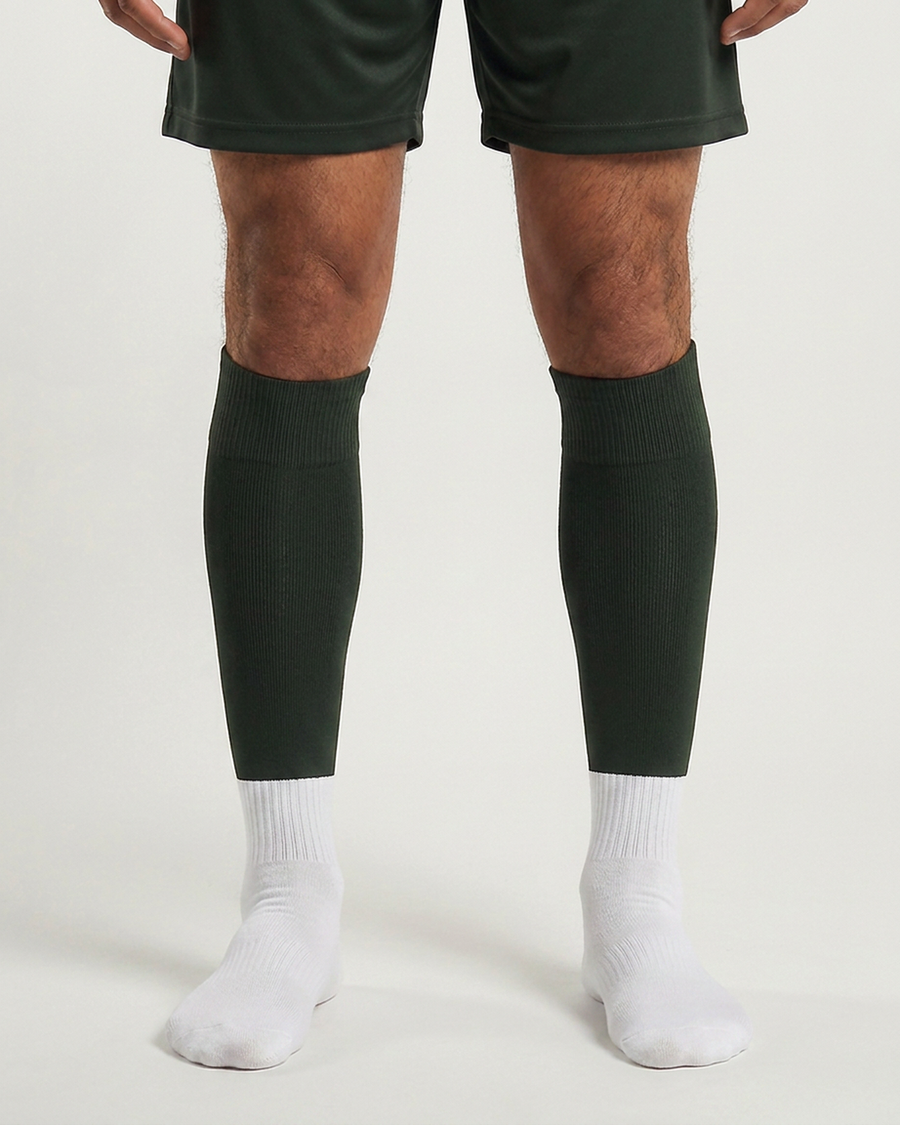 Farrellys World football sock sleeve worn over a white crew sock - Olive Green