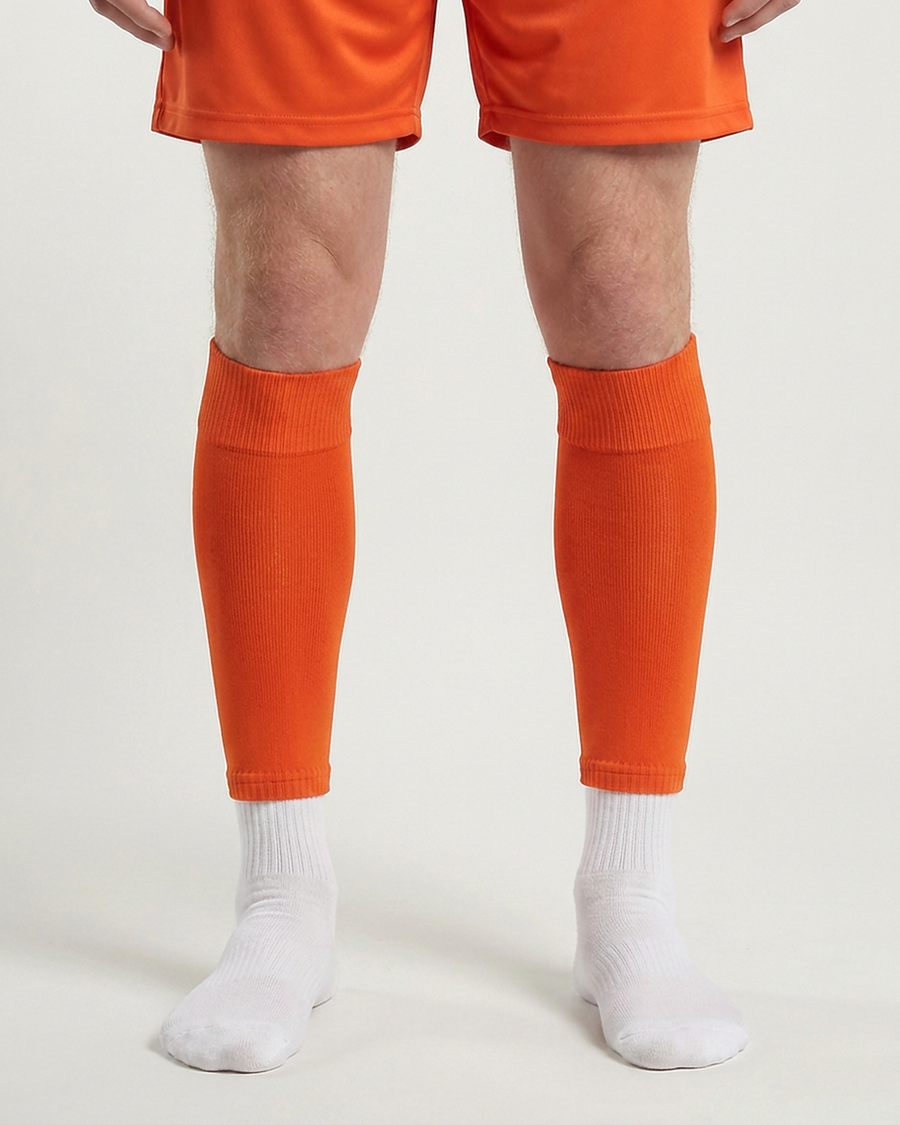 Farrellys World football sock sleeve worn over a white crew sock - Orange