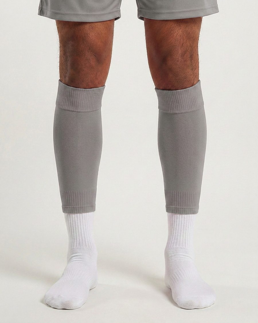 Farrellys World football sock sleeve worn over a white crew sock - Silver Grey